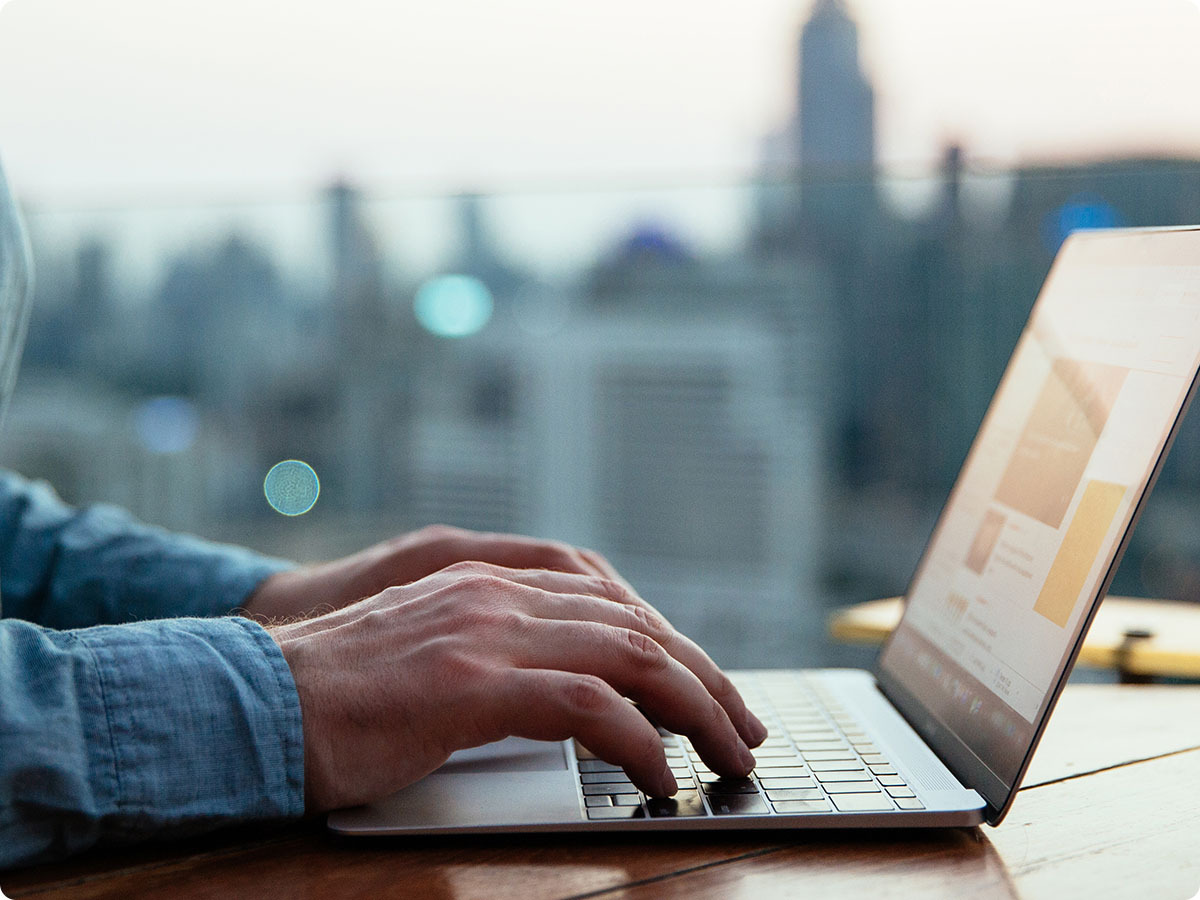 person typing on a laptop